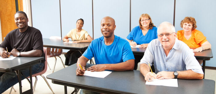 Six people taking down notes