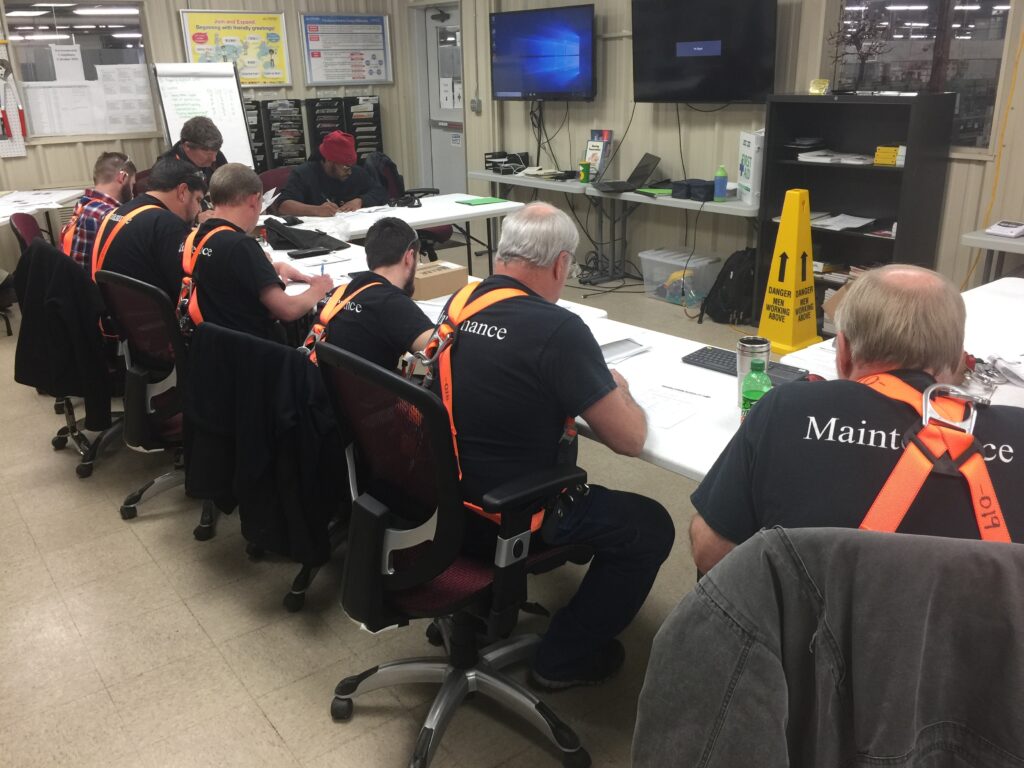 A group pf men wearing construction safety outfit